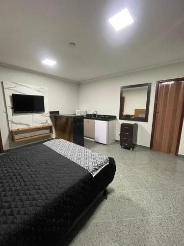 TV a/nebo společenská místnost v ubytování Loft Moderno no Centro