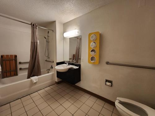 a bathroom with a sink and a toilet and a shower at Motel 6-Baytown, TX - Baytown East in Baytown