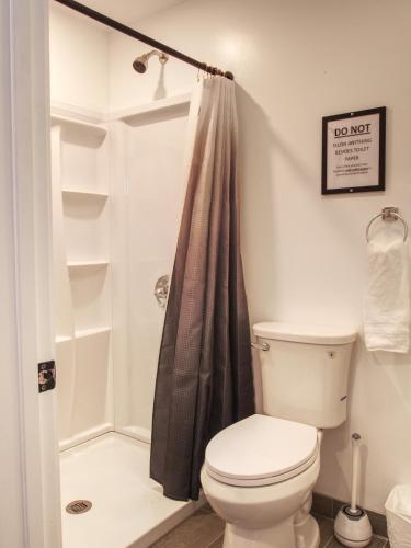 a bathroom with a toilet and a shower at Vermont Suites in South Burlington