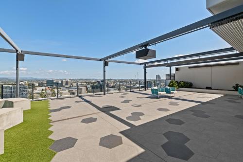 a roof deck with a view of the city at breathtaking Fortitude valley Apartment in Brisbane