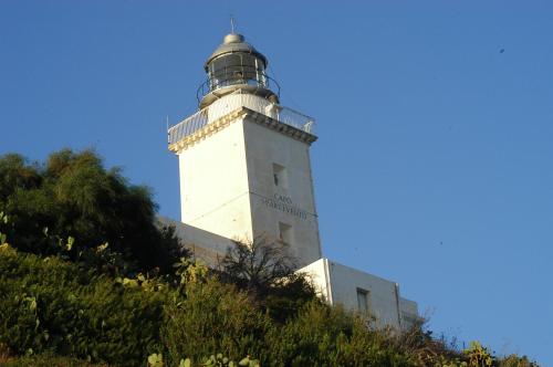 a lighthouse on the side of a hill at B&B Casa Cosmano in Brancaleone Marina