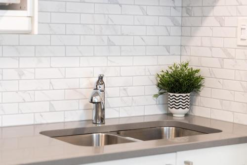 a kitchen sink with a potted plant on it at Studio Condo @ North Creek|Pool/Hot Tub/Crave TV in Blue Mountains