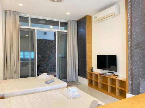 Qli Hotelにあるベッド