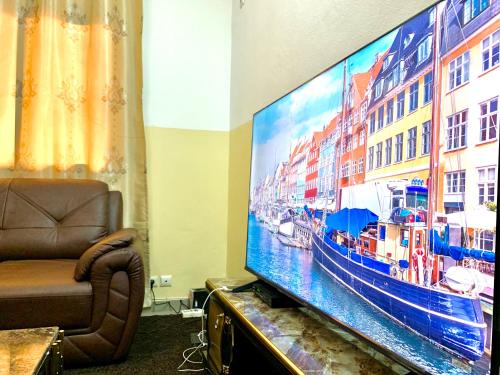 Grant Lexus Apartment Mimbomanにあるテレビまたはエンターテインメントセンター