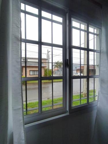 an open window with a view of a street at Casa Alma San Pedro in San Pedro