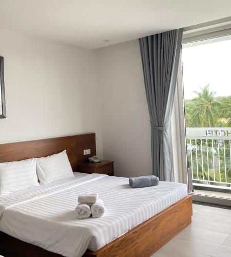 Qli Hotelにあるベッド