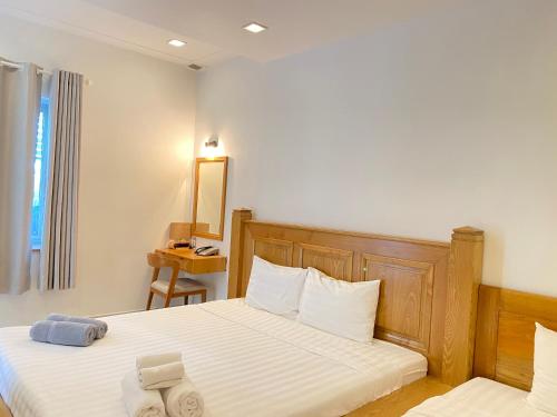 Qli Hotelにあるベッド