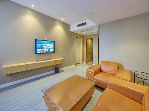 Телевізор і / або розважальний центр в Metropolo Hotel Jiangyin Hongqiao Road Baiye Plaza