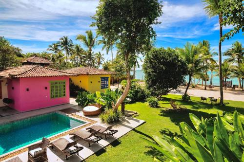 an aerial view of a house with a swimming pool at Pousada Villa Tainá - Arraial d'Ajuda, Bahia in Arraial d'Ajuda