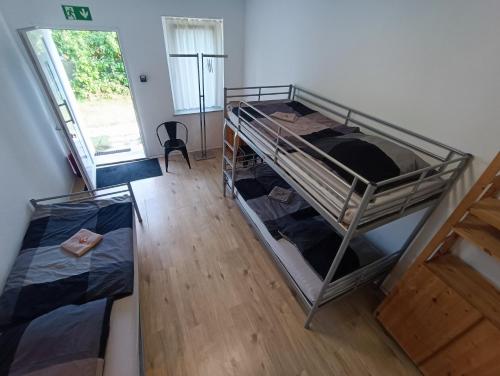an overhead view of a room with two bunk beds at GranseeHOSTEL in Gransee