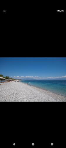 a picture of a beach with the ocean and the sky at Rallis village apartments in Paralía Akrátas