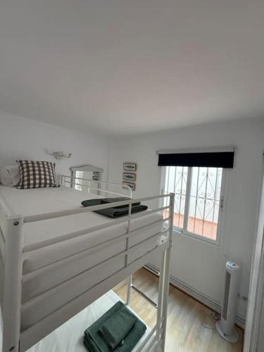 Ένα ή περισσότερα κρεβάτια σε δωμάτιο στο Apartament sea view and direct beach access