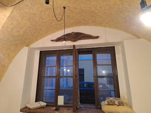 a room with a large window with a view at Ubytování u Alfonse Muchy in Mikulov