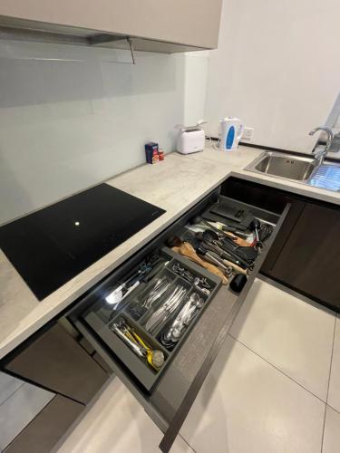 a kitchen with a stove top oven in the middle at Duplex Penthouse in Sliema in Sliema