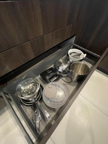 a counter with some pans and utensils on it at Duplex Penthouse in Sliema in Sliema