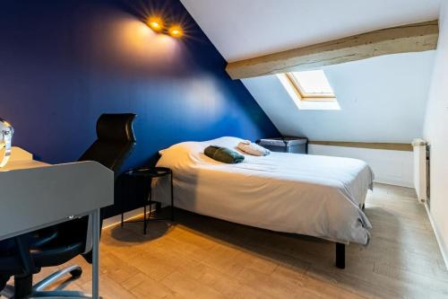 En eller flere senge i et værelse på Le Liberté Coeur de ville Duplex