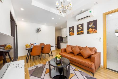 a living room with a couch and a table at TMS Quy Nhon - Ngoc Lan Apartments in Quy Nhon