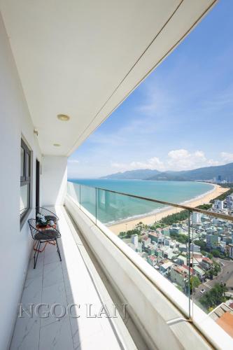 a balcony with a view of the ocean at TMS Quy Nhon - Ngoc Lan Apartments in Quy Nhon