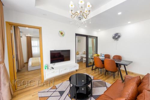 a living room with a couch and a table at TMS Quy Nhon - Ngoc Lan Apartments in Quy Nhon
