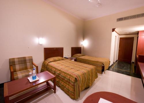 Säng eller sängar i ett rum på Nala Hotels
