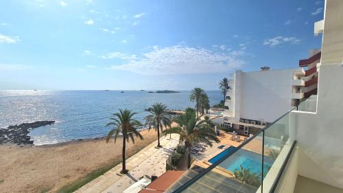 a view of the beach and ocean from a building at Apartamentos Llobet Ibiza in Ibiza Town