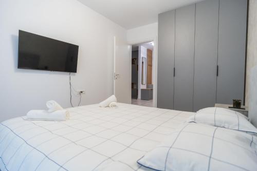 Ένα ή περισσότερα κρεβάτια σε δωμάτιο στο Hills Residence Premium Apartment in Pallady
