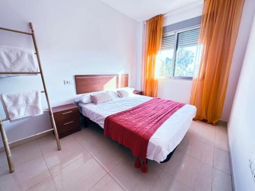 Katil atau katil-katil dalam bilik di Apartamento Familiar a 1 Min del Mar