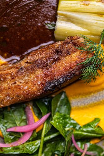 two pieces of meat and vegetables on a plate at L'Auberge de Mens in Mens