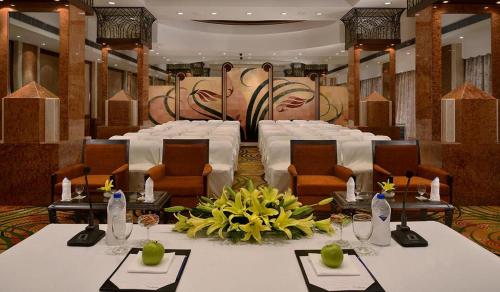 a room with tables and chairs and a set up for a banquet at Hotel Marine Plaza in Mumbai
