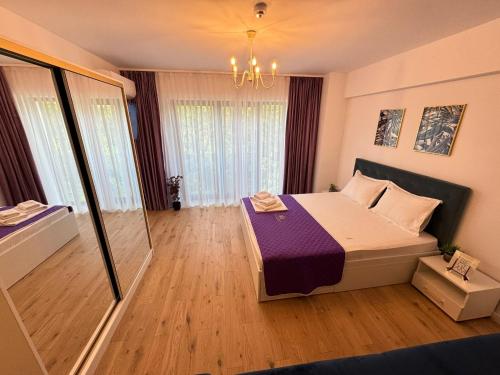 a small room with a bed and a window at Luxury Studios at Unique opposite Palas with Parking in Iaşi