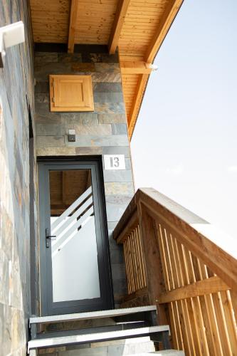 an open door to a building with a wooden ceiling at Apartments LFCI - Hrabušice in Hrabušice