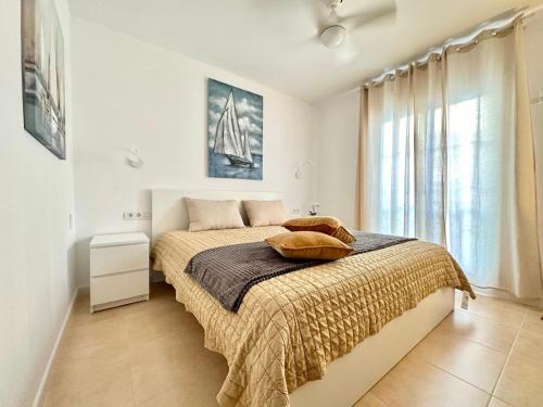 a bedroom with a bed and a large window at Luxury Apartment Tenerife in Adeje