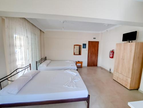 Postel nebo postele na pokoji v ubytování Poly's House