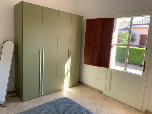 En eller flere senge i et værelse på Casa vacanza Mamaioa