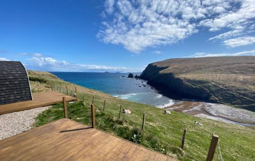 a view of the ocean from a house at SEApods - Isle of Lewis - Luxury en-suite pods on the edge of the Atlantic Ocean in Aird Uig