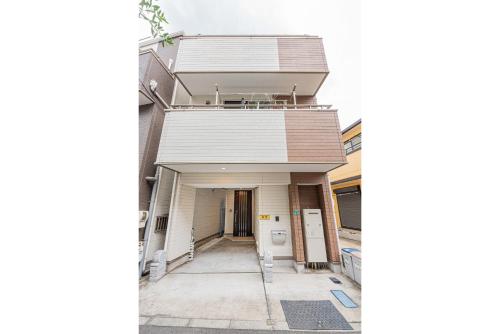 a view of the front of a house with a hallway at Otsuka house with 3BR near the Yamanote line in Tokyo