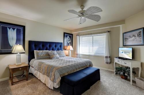 a bedroom with a bed and a ceiling fan at 226 Captain's Quarters in Hilton Head Island