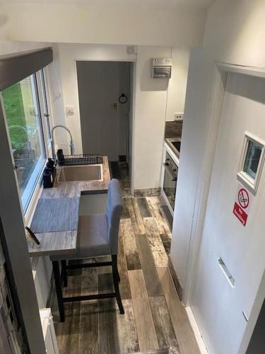 a small kitchen with a table and a sink at Studio 49 home from home in Birmingham