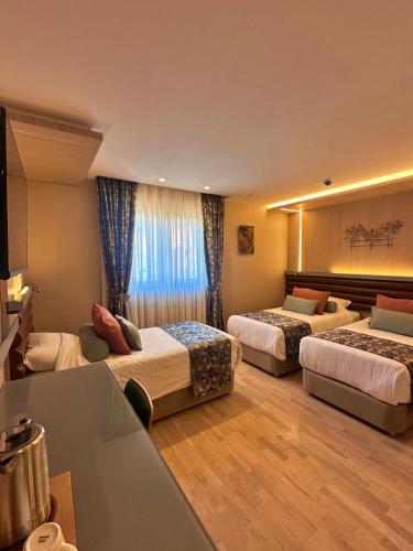Llit o llits en una habitació de Hotel Sapphire