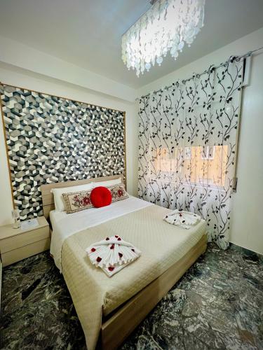 a bedroom with a bed with a red pillow on it at Venice VIP Guest House in Mestre