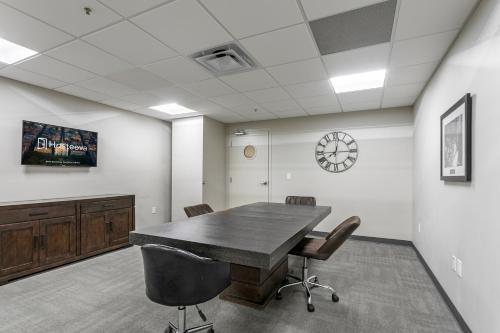 an office with a conference room with a table and chairs at Tasteful Condo Walking Distance to French Quarter in New Orleans