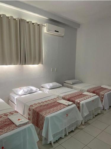 Postel nebo postele na pokoji v ubytování San Felipe Hotel