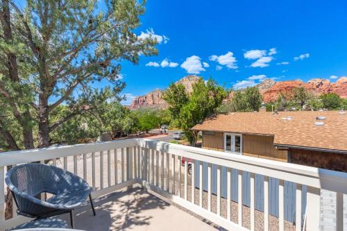 a balcony with a chair and views of the mountains at Amethyst Retreat. Back Yard with Hot Tub & Views! in Sedona