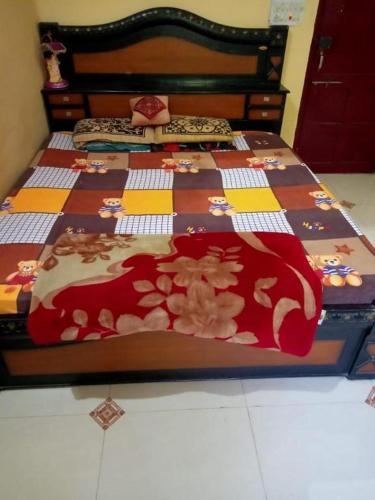 Ένα ή περισσότερα κρεβάτια σε δωμάτιο στο Shree Balashish Home Stay