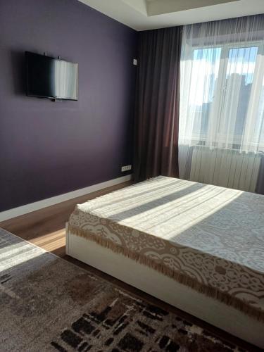 En eller flere senge i et værelse på Apartment green park