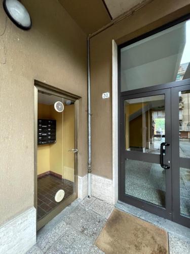 an entrance to a building with a glass door at Casa Maira in Luino