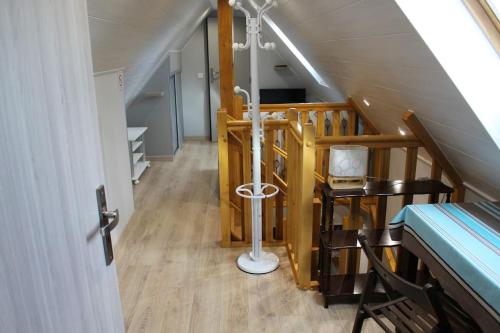 a room with a stairway with a staircase at Garte Hiesel la maison de jardin Piscine été 2026 in Scherwiller