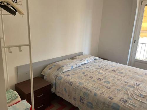 a bedroom with a bed and a lamp in it at Isola nel cielo Terrazza Salento in Tricase