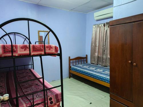 Katil atau katil-katil dalam bilik di Homestay Al-Idrus Jitra