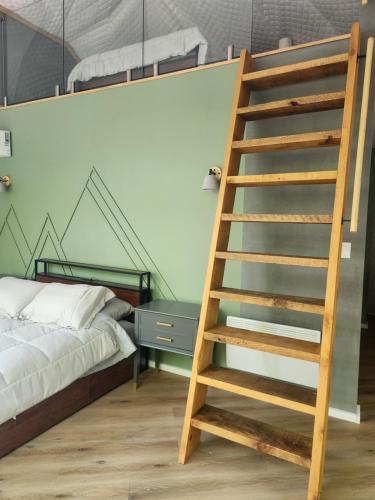 Un ou plusieurs lits dans un hébergement de l'établissement Dômes nordik 4 saisons